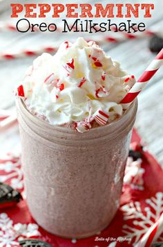 peppermint oreo milkshake in a glass with candy canes