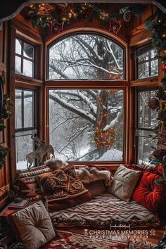 a living room filled with lots of furniture and christmas tree in the window sill