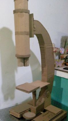 a cardboard model of a machine that is on top of a table