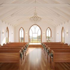 an empty church with wooden pews and flowers