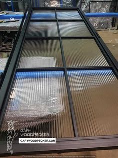 an image of a glass window in the process of being installed at loft doors eu