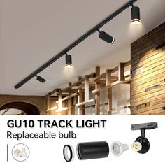 three track lights with remote controls on the ceiling