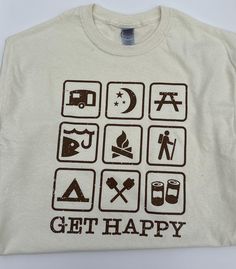 Embrace the great outdoors and spread some joy with our "Get Happy" camping-themed t-shirt! Made from high-quality Gildan heavy cotton, this natural-colored tee is perfect for all your adventures, whether you're hiking, camping, or just enjoying a relaxing day outside. Featuring a fun and inspiring message, "Get Happy," along with charming camping-themed graphics, this shirt captures the spirit of adventure and positivity. Proudly printed and shipped in the USA, it offers durability and comfort Happy Camper Tshirt, Camper Tshirt, Adult Summer Camp, Camping Tshirt, Camp Shirts, Going Camping, Camping Tee, Camp Style, Inspiring Message