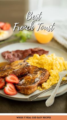 a plate with eggs, strawberries, and meat on it next to orange juice