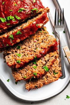 slices of meatloaf on a plate with a fork