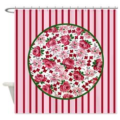 a red and white striped background with pink roses in the center on a circular plate