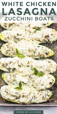 white chicken lasagna zucchini boats on a baking sheet with text overlay