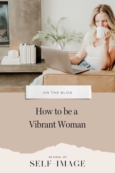 a woman sitting on a couch with her laptop and coffee cup in front of her