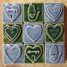 hand and heart tiles are arranged on a table