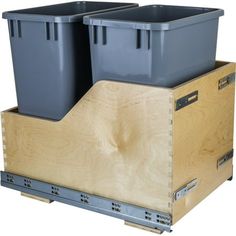 two plastic bins are stacked on top of each other in a wooden container holder