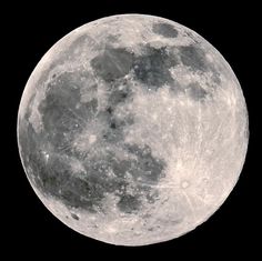 the full moon is shown in black and white