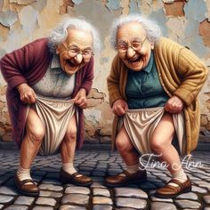 two old women sitting next to each other on cobblestone pavement with brick walls behind them