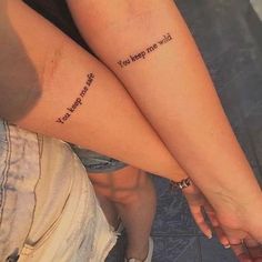 two people with matching tattoos on their legs that say, i love you more than me