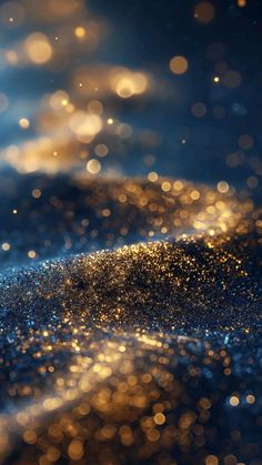 blurry gold and blue background with lots of sparkle