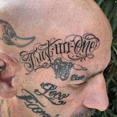 a man with some tattoos on his head