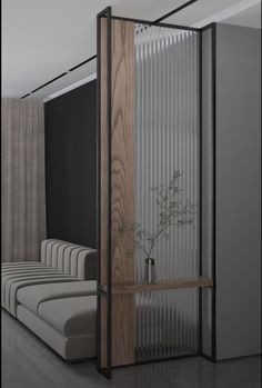 the room divider is made out of wood and glass, with a plant in it