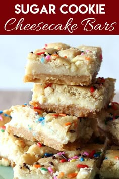 sugar cookie cheesecake bars stacked on top of each other