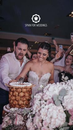 a bride and groom cutting their wedding cake