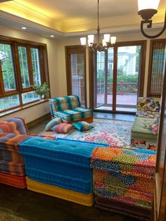 a living room filled with lots of colorful furniture