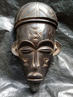 an african mask is shown on a sheet