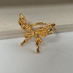 🌻This Gold Butterfly Ring features a delicate butterfly design, adding a touch of elegance and charm to your style. 🥰This piece is meticulously crafted from S925 sterling silver (total 5.6g) and finished with a luxurious coating of genuine 18k gold plating. 🥰This ring is adjustable to fit your desired size. 🥰We will send it in a beautiful jewelry box and package it carefully. We offer boxes in blue, green, white, and black. Please leave a message specifying your preferred color 🥰Please leav Butterfly Ring Gold, Gold Butterfly Ring, Beautiful Gold Rings, Butterfly Rings, Delicate Butterfly, Jewelry Piercing, Ring Elegant, Body Jewelry Piercing, Jewelry Aesthetic