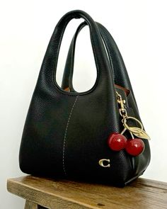 Coach Bag With Cherry Charm, Cherry Coach Bag, Coach Cherry Bag, Cute Bags And Purses, Cherry Accessories, Purses Aesthetic, Coach Aesthetic, Handbags Aesthetic, Aesthetic Purse