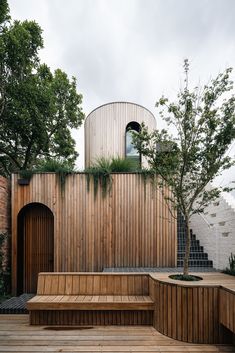 a wooden bench sitting on top of a wooden deck