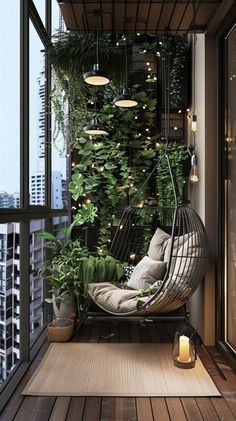 an outdoor hanging chair with plants and lights on the side of it, in front of a large window