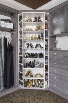 an organized closet with white shelves and shoes on the bottom shelf in front of it