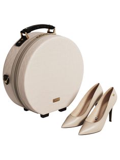 a woman's white bag and pair of high - heeled shoes on a white background