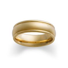 a yellow gold wedding ring on a white background