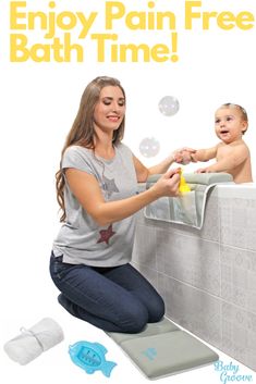 a woman sitting on the edge of a bath tub with bubbles coming out of it