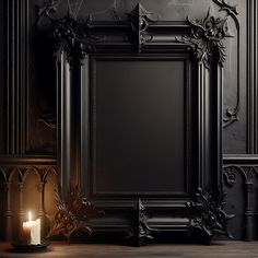 an ornate frame with a lit candle in front of it on a wooden floor next to a black wall