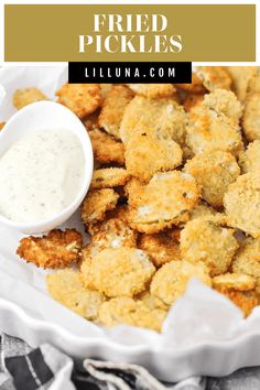 fried pickles in a white bowl with ranch dressing on the side and text overlay