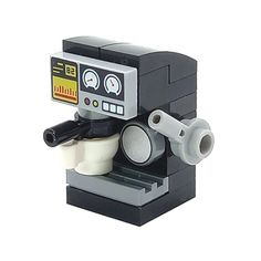 a lego coffee maker is shown with the machine on it's stand and cup holder