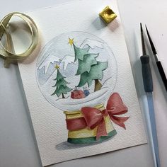 a watercolor painting of a snow globe with christmas trees inside and presents in it