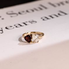 a close up of a ring on top of a book