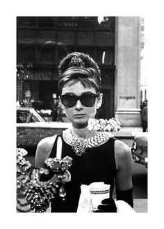 black and white photograph of a woman wearing sunglasses