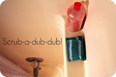 a bathroom sink with a bottle of soap next to the faucet and towel rack