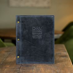 a book sitting on top of a wooden table