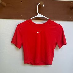 Never Worn, Womens Nike Crop Top Tee. Soft Fabric Nike Casual Top In University Red, Nike Red T-shirt For Summer, Red Nike T-shirt For Summer, Nike Sporty Tops In University Red, Nike Red Sporty Tops, Nike Sporty University Red Tops, Nike Sporty Red Top, Nike Basic Tops For Spring, Trendy Nike Short Sleeve Tops