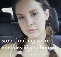 a woman sitting in the back seat of a car with a quote above her head