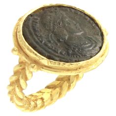 Ancient Roman Coin Crossed Rope Ring in Satin Yellow Gold, from Sacchi’s "Rome" Collection, hand-crafted with lost-wax casting technique. Lost-wax casting, one of the oldest techniques for creating jewelry, forms the basis of Sacchi's jewelry production. Modelling wax in the round allows to sculpt small and large pieces, and polishing with agate stones gives characteristic light effects. The Ring is comprised of 18 Karat Yellow Gold Satin Finish, set with an Antique Roman Coin in the center. Rom Indian Rings, Ancient Roman Coins, Buy Gold And Silver, Rope Ring, Rope Rings, Egyptian Hieroglyphics, Roman Coins, Gold Satin, Coin Ring