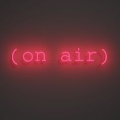 a neon sign that reads on air