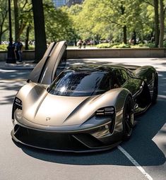 a silver sports car is parked on the street