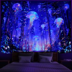 a bedroom with jellyfish on the wall and blue lights in the room behind it