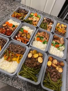 several trays filled with different types of food