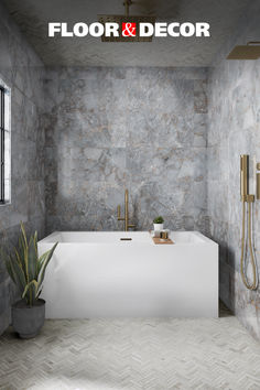 a bathroom with stone walls and flooring next to a bathtub