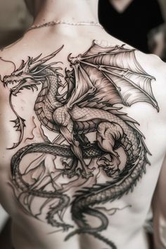 a man with a dragon tattoo on his back