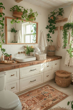 a bathroom with plants hanging on the wall and a rug in front of the sink